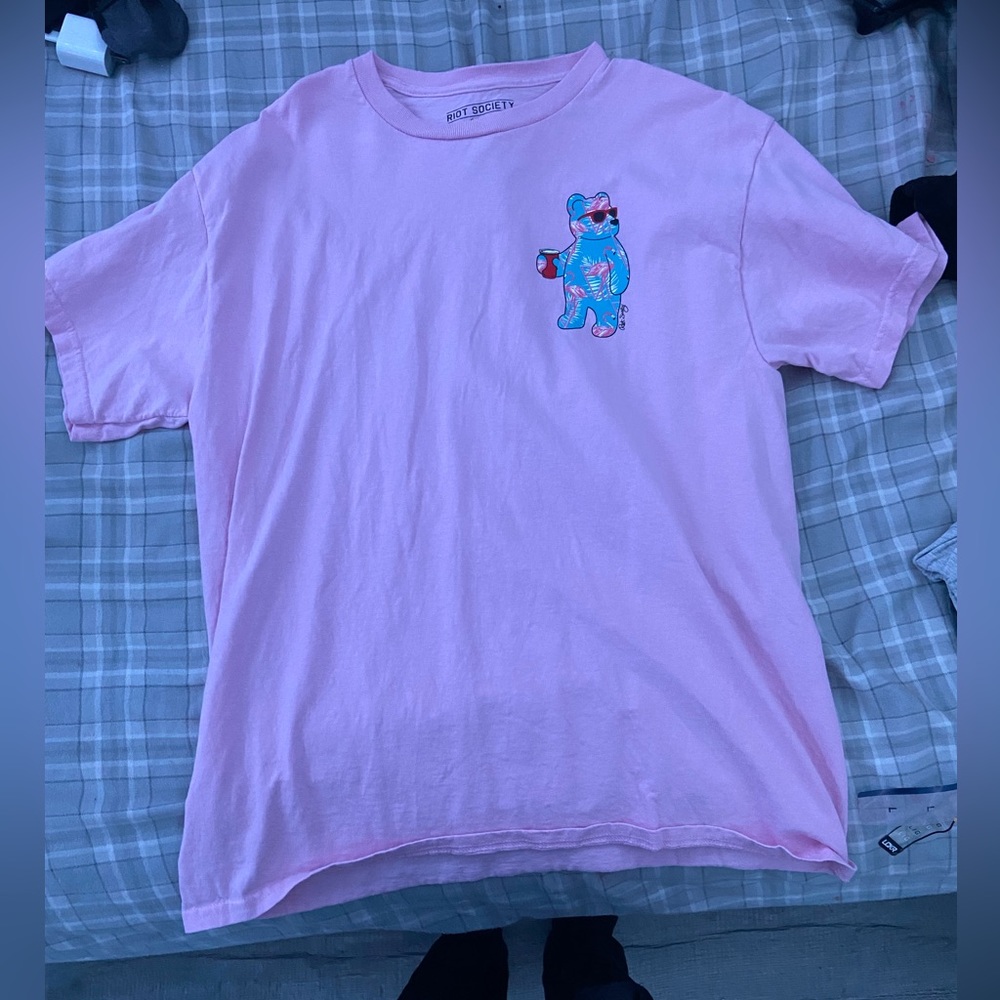 pink shirt with blue gummy bear design